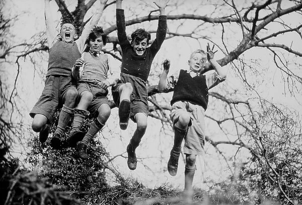 Four jumping boys