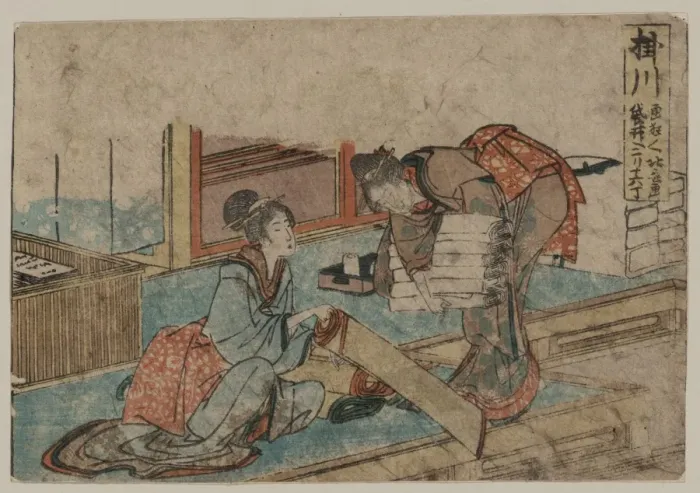 Framed Print : Kakegawa. Print shows two women rolling up carpets. Date 1804 Framed Print : Kakegawa. Print shows two women rolling up carpets. Date 1804