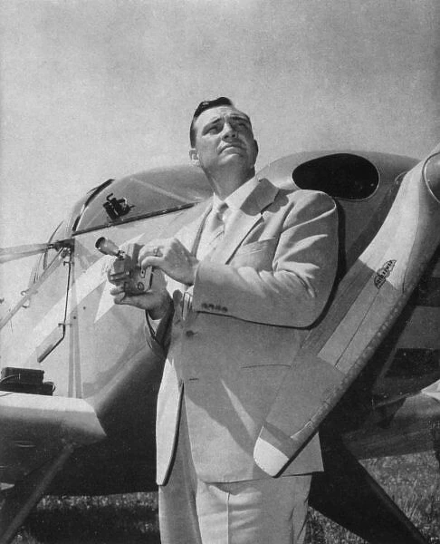 Kenneth Arnold stands beside his private aircraft