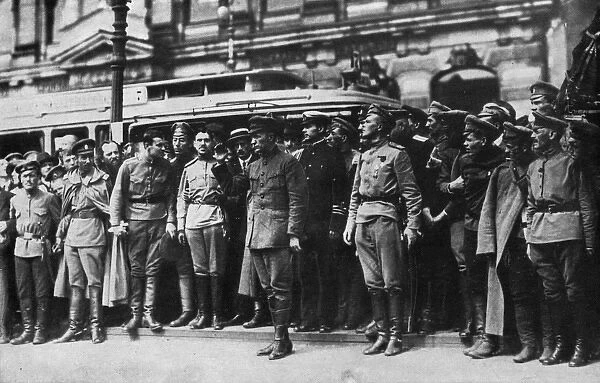 Kerensky reviewing Cossack soldiers in a Russian street