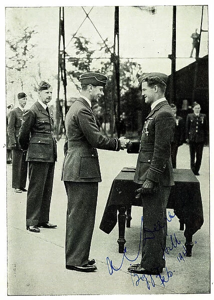 King George VI decorating Squadron Leader A. C. Deere