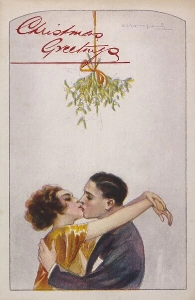 KISSING. Putting the mistletoe to good use