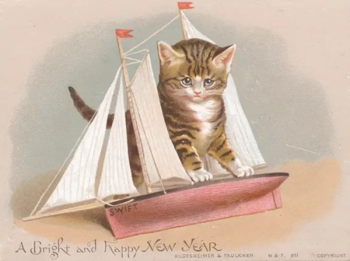 Framed Print : Kitten with toy sailing ship on a New Year card Framed Print : Kitten with toy sailing ship on a New Year card