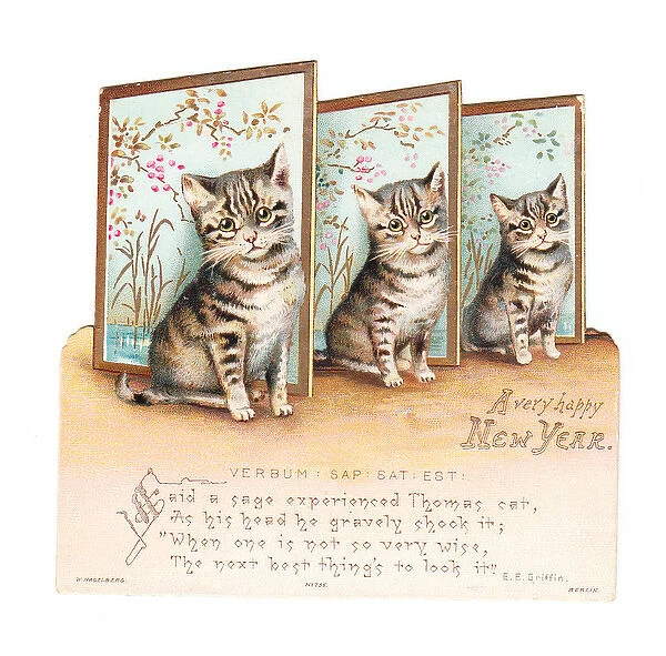 Three kittens on a cutout New Year card