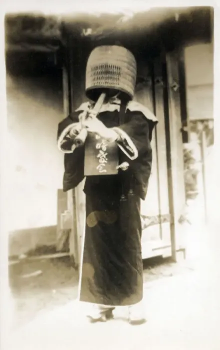 Framed Print : Kobe, Japan - A komuso (monk of the Fuke sect) wearing a basket hat (tengai or tengui) and playing the shakuhachi bamboo flute. Date: 1928 Framed Print : Kobe, Japan - A komuso (monk of the Fuke sect) wearing a basket hat (tengai or tengui) and playing the shakuhachi bamboo flute. Date: 1928