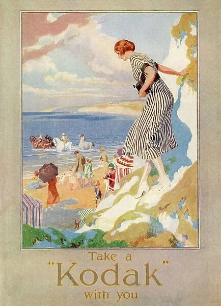 Kodak 1924 Advert. A woman cautiously descends a cliff path to the beach