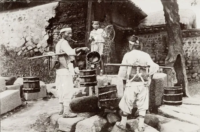 Framed Print : Korea: men taking water from a well Framed Print : Korea: men taking water from a well