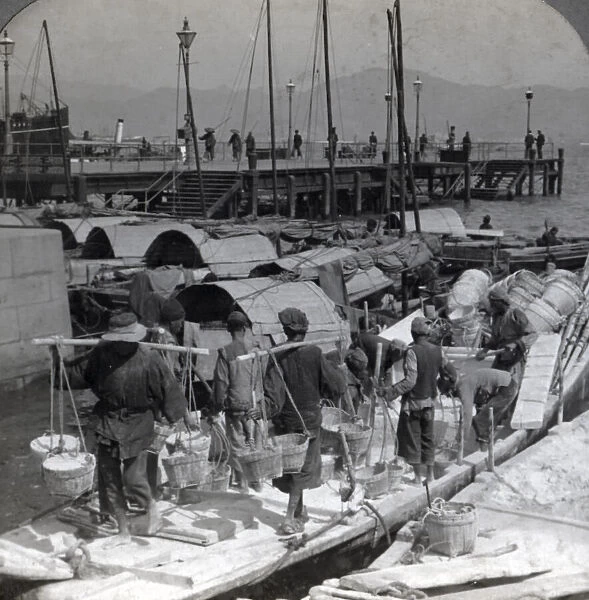 Labourers unloading a barge, Hong Kong, c. 1900 Vintage early 20th century photograph