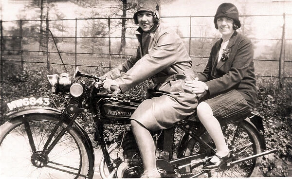 Two ladies on New Imperial motorcycle