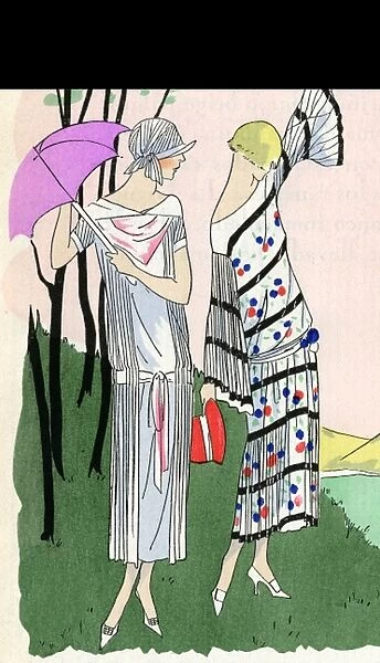 Two ladies in outfits by Doucet and Martial et Armand
