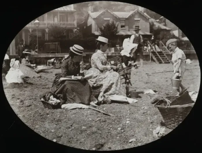Framed Print : Two ladies sitting on what appears to be a beach Framed Print : Two ladies sitting on what appears to be a beach