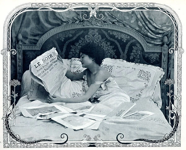 Lady reading the newspaper in bed