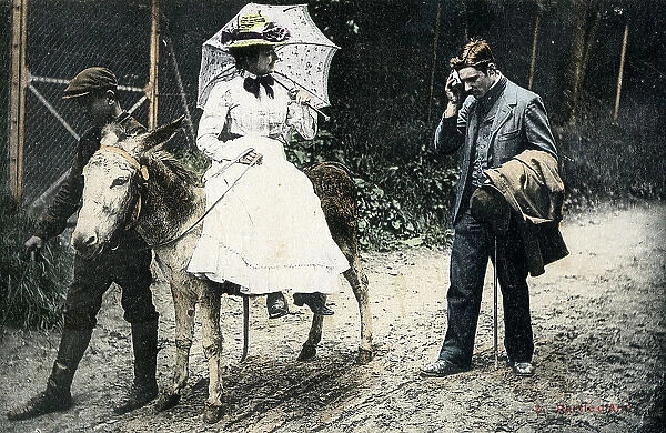 Lady riding side-saddle on a donkey