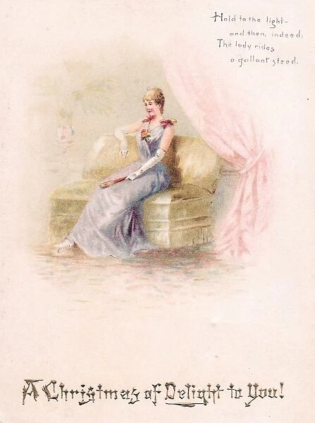 Lady seated on a sofa on a Christmas card