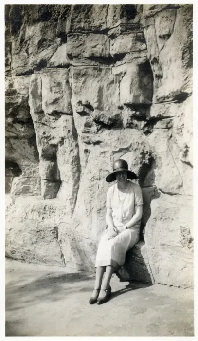 Framed Print : Lady sitting on a natural seat beneath a rock cliff Framed Print : Lady sitting on a natural seat beneath a rock cliff