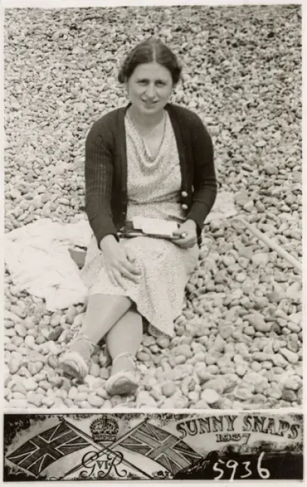Framed Print : Lady on a south coast beach writing postcards to family Framed Print : Lady on a south coast beach writing postcards to family