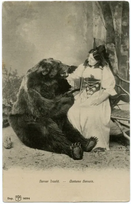 Framed Print : A lady in Traditional Bernaise costume posing with a bear Framed Print : A lady in Traditional Bernaise costume posing with a bear