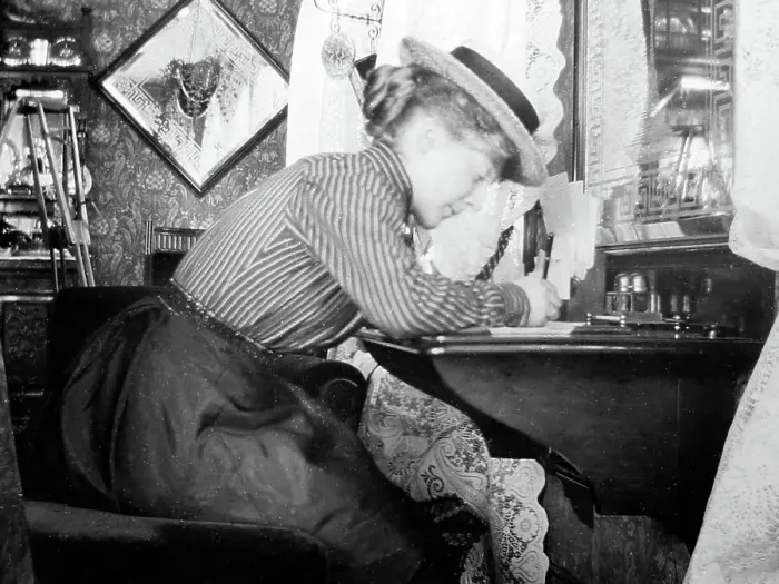 Framed Print : Lady writing at her desk, early 1900s Framed Print : Lady writing at her desk, early 1900s