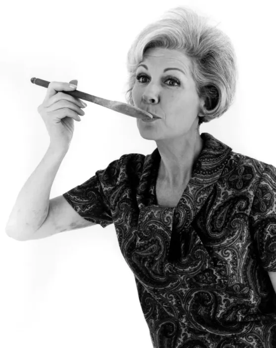 Framed Print : YUMMY. A woman sees what her cooking tastes like. Date: late 1960s Framed Print : YUMMY. A woman sees what her cooking tastes like. Date: late 1960s