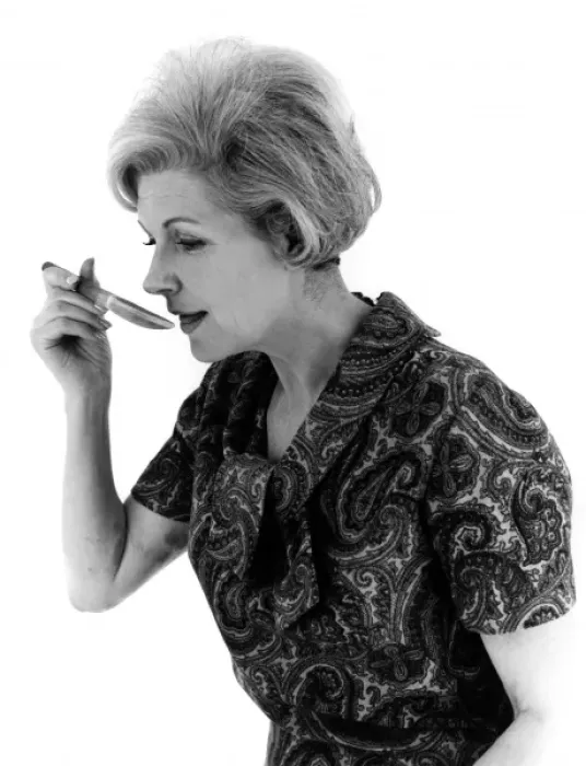 Framed Print : YUMMY. A woman sees what her cooking tastes like. Date: late 1960s Framed Print : YUMMY. A woman sees what her cooking tastes like. Date: late 1960s