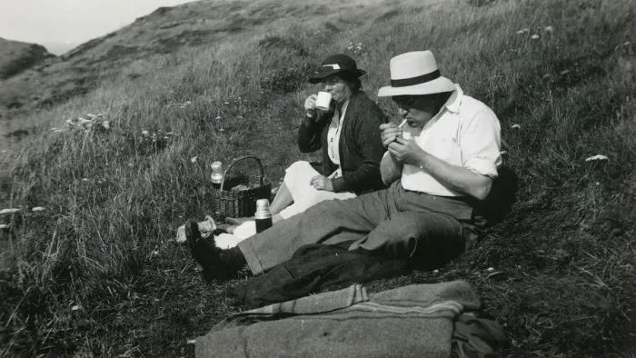 Framed Print : A late middle-aged couple enjoying a picnic Framed Print : A late middle-aged couple enjoying a picnic