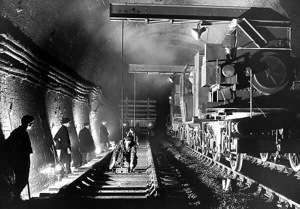 Laying railway tracks in the Severn Tunnel, 1930s maybe