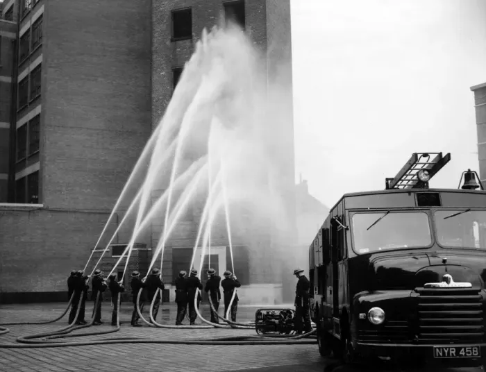 Framed Print : LFB firefighters in multi-hose display Framed Print : LFB firefighters in multi-hose display