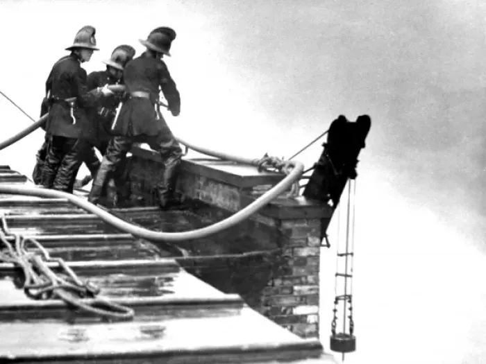 Framed Print : LFB firefighters working on a roof at a warehouse fire Framed Print : LFB firefighters working on a roof at a warehouse fire