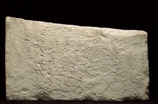 Limestone tombstone with inscription