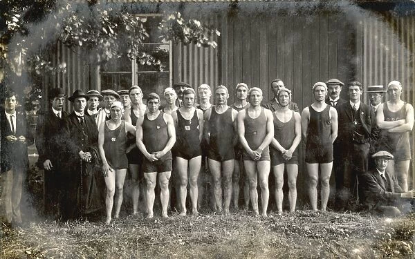 Line-up of twelve swimmers and twelve men in suits