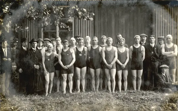 Framed Print : Line-up of twelve swimmers and twelve men in suits Framed Print : Line-up of twelve swimmers and twelve men in suits