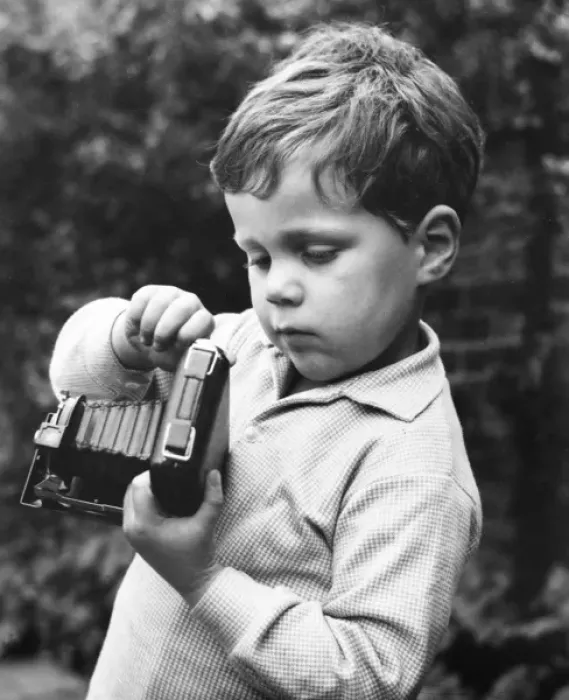 Framed Print : Little boy with a camera in a garden Framed Print : Little boy with a camera in a garden