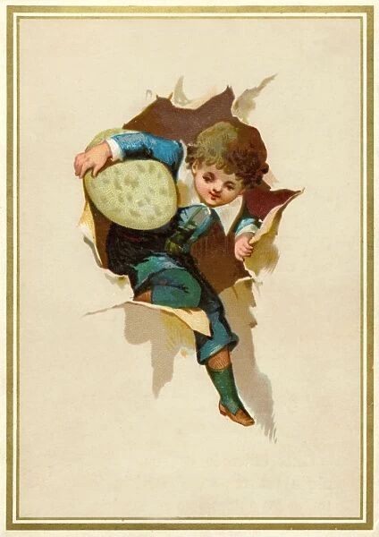 Little boy with an Easter egg bursting through paper