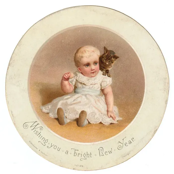 Framed Print : Little child with kitten on a circular New Year card Framed Print : Little child with kitten on a circular New Year card