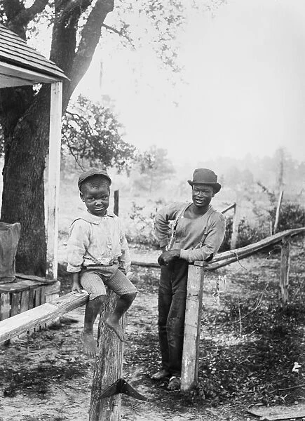 Little Eb Snow, African-American boy with his father in Amer