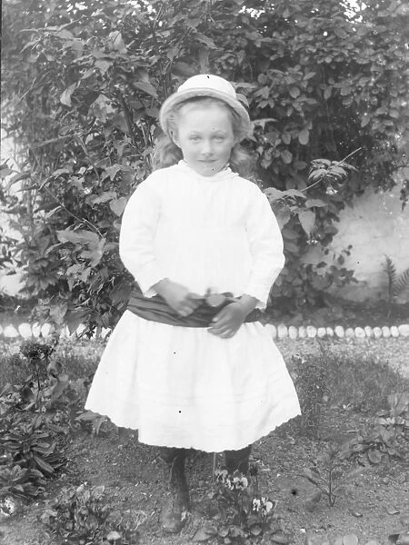 Little Edwardian girl in a garden, Mid Wales