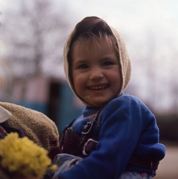 Little gipsy girl with yellow flowers, Charlwood, Surrey