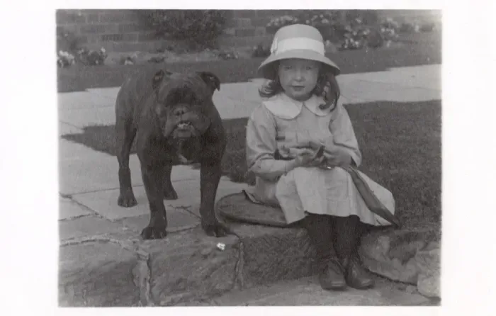 Framed Print : Little girl and bulldog in a garden Framed Print : Little girl and bulldog in a garden