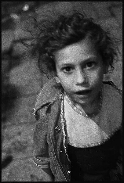 Little girl in Cairo street at night - Egypt. Date: 1980s