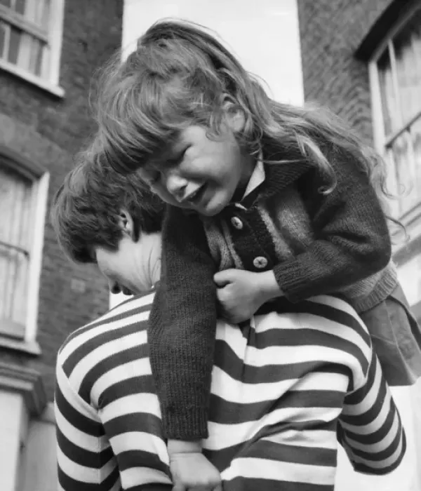 Framed Print : Little girl being carried, Balham, SW London Framed Print : Little girl being carried, Balham, SW London