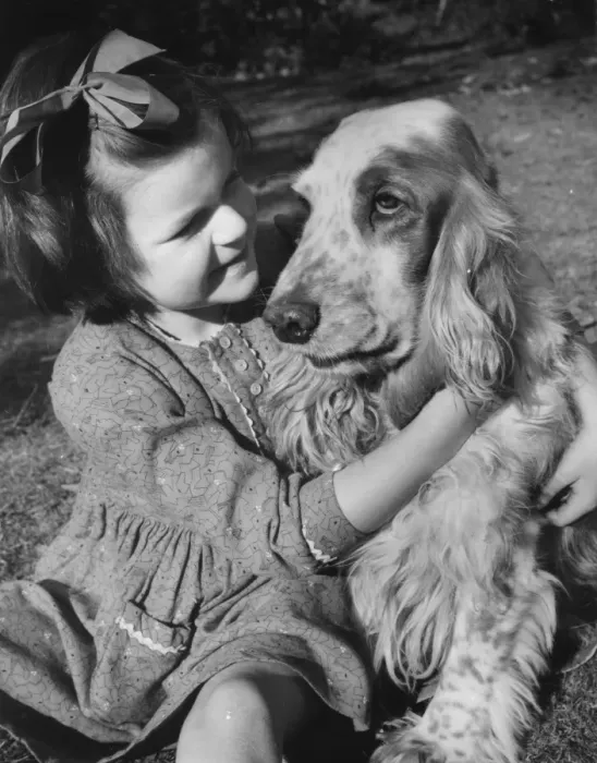 Framed Print : Little girl and dog in the garden Framed Print : Little girl and dog in the garden