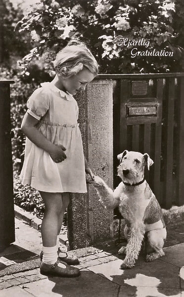 Little girl and dog on a greetings postcard, Sweden