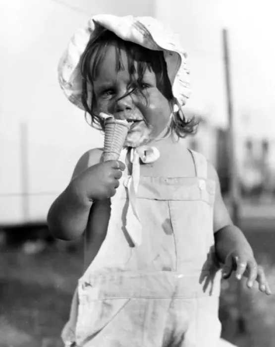 Framed Print : Little girl enjoying an ice cream Framed Print : Little girl enjoying an ice cream