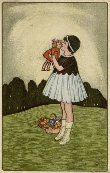 Little girl on a hillside with her doll