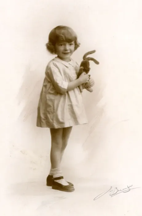 Framed Print : Little girl holds a toy rabbit, circa 1930s Framed Print : Little girl holds a toy rabbit, circa 1930s