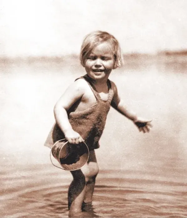 Framed Print : Little girl paddling, with bucket Framed Print : Little girl paddling, with bucket