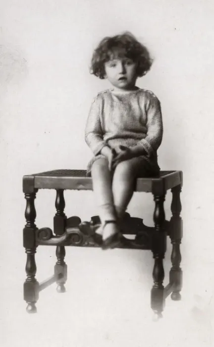 Framed Print : A Little girl photographed on a turned wooden stool Framed Print : A Little girl photographed on a turned wooden stool