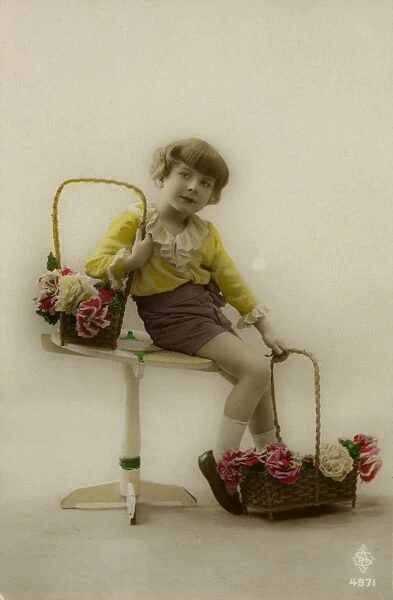 Little girl on a postcard with baskets of flowers