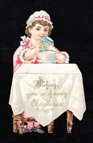 Little girl at a table on a cutout Christmas card