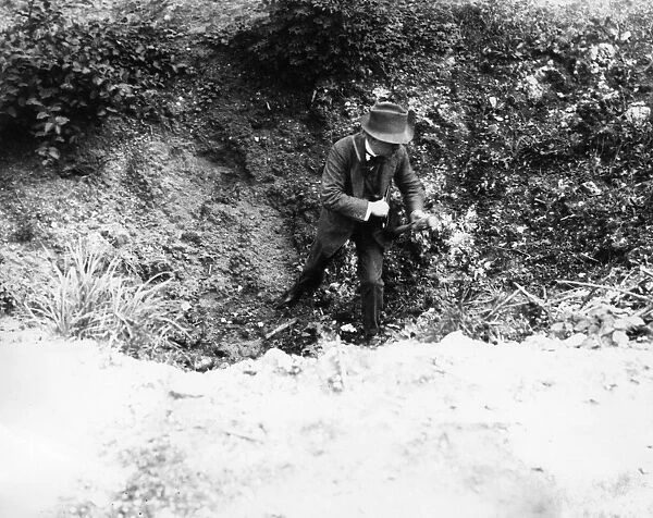 Lloyd George in shell hole, Fricourt, France, WW1
